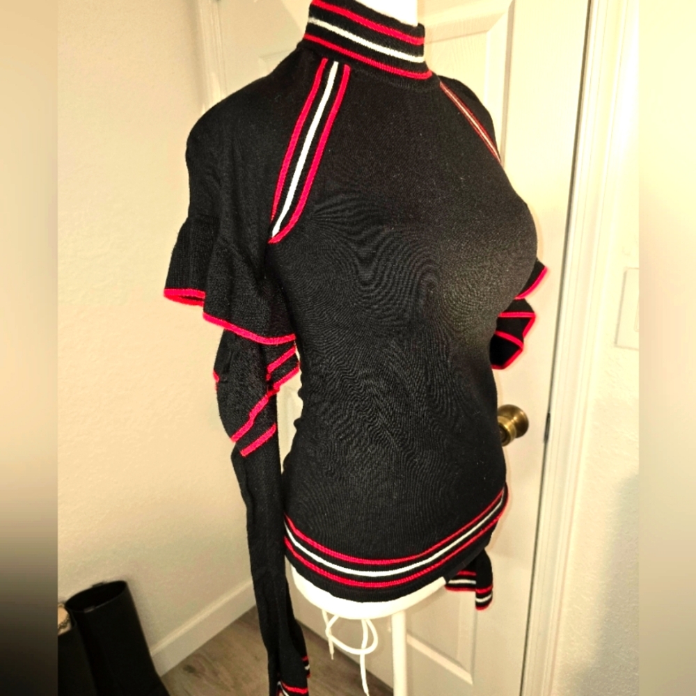 Belle Vere Black Sweater with white and red ruffled accents. Size M